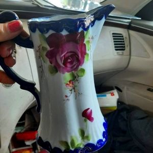 This is a vintage hand painted Nippon creamer it is around 8in tall hand painted